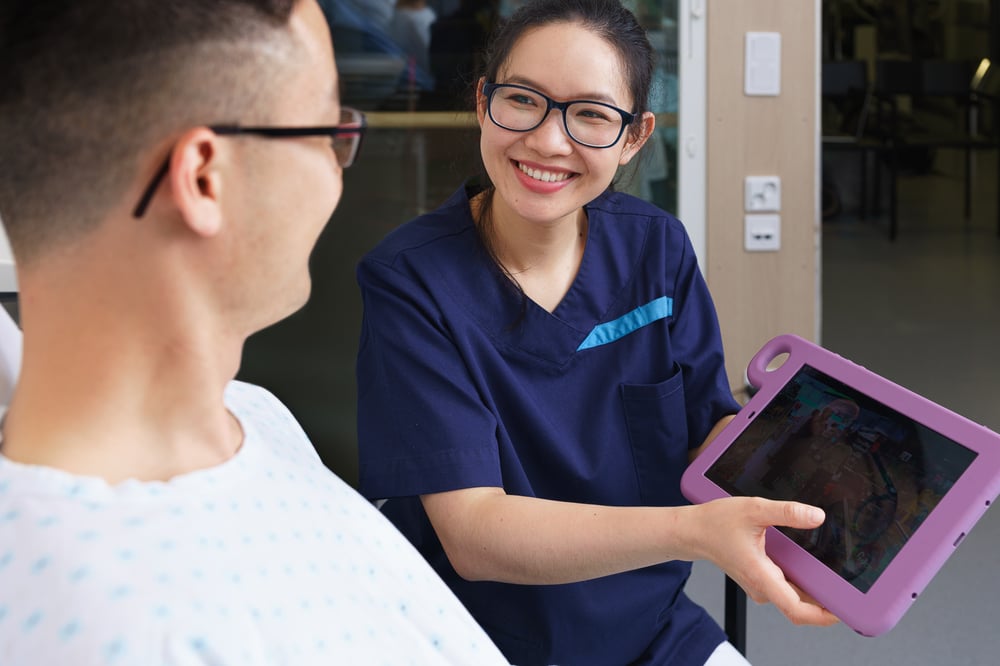 Nurse and man use Hublet tablet - front - web